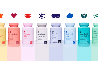 Love Wellness vitamin bottles on display in a variety of colors