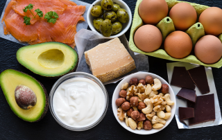 keto diet foods like salmon, avocado, eggs, dark chocolate and nuts